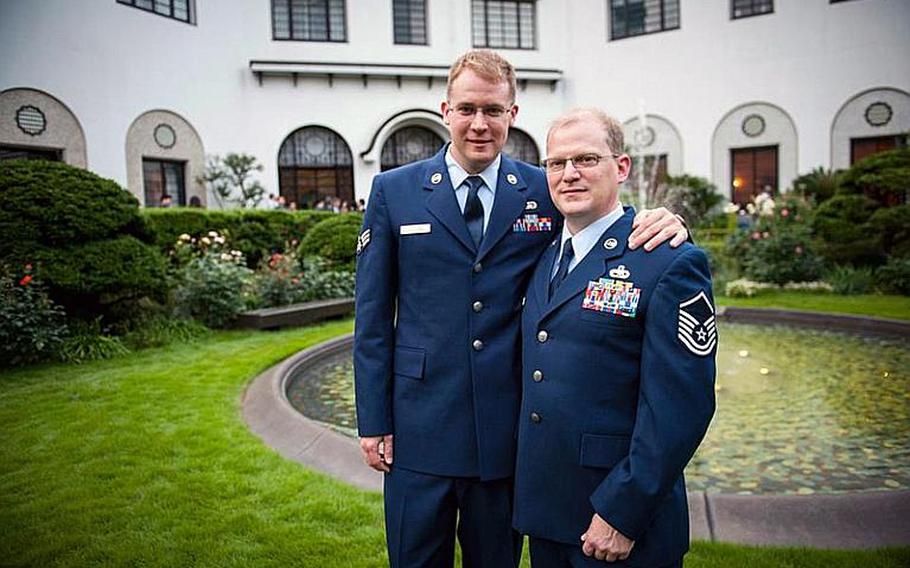 Senior Airman Luke Bullard, left, and Master Sgt. Marc Maschhoff, both from Misawa Air Base, Japan, pose for a photo June 4, 2012, at the home of U.S. Ambassador to Japan John Roos in Tokyo. The ambassador held a reception Monday evening to commemorate Lesbian, Gay, Bisexual, Transgender Pride Month, which President Barack Obama has proclaimed each June since taking office in 2009.