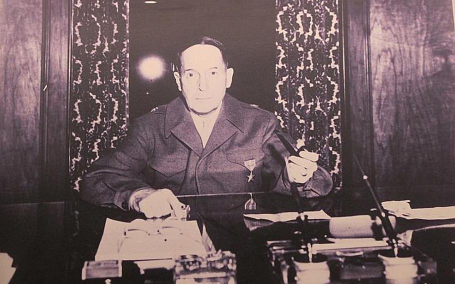 This picture of Gen. Douglas MacArthur at work is exhibited in a room adjacent to his former office on the sixth floor of the Dai-Ichi Life Insurance Company in Tokyo. MacArthur oversaw the administration of Japan for nearly six years following the end of WWII. His office, along with two adjacent rooms, is open to the public through Sunday.
