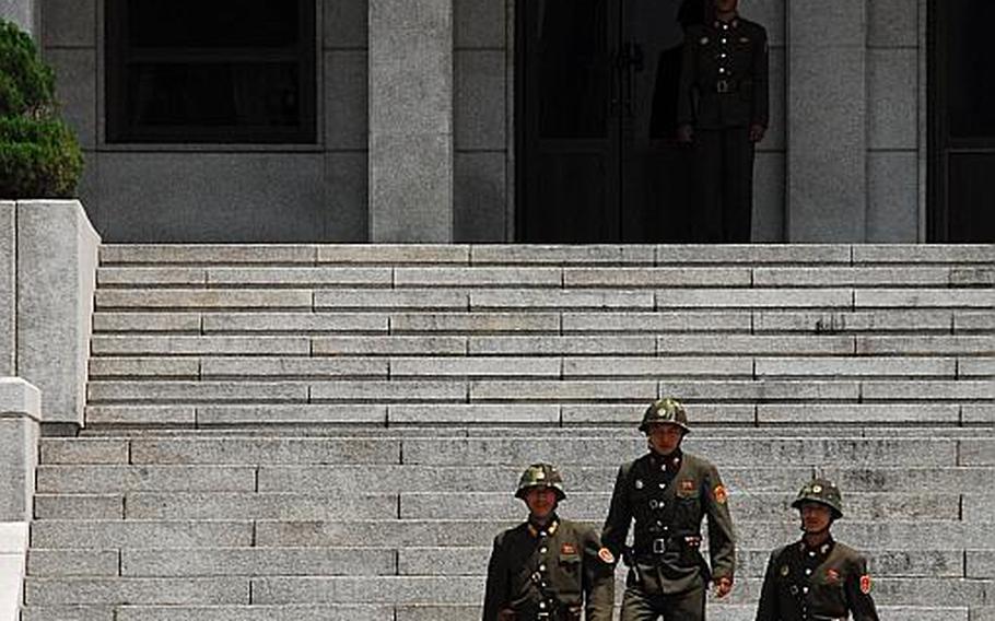North Korean soldiers head for the Joint Security area of the Demilitarized Zone on July 27, 2012, to pose for photos. In an amusing display of gamesmanship, dignitaries from the U.S., South Korea and other countries posed for photos while North Korean soldiers staged a photo shoot of their own.