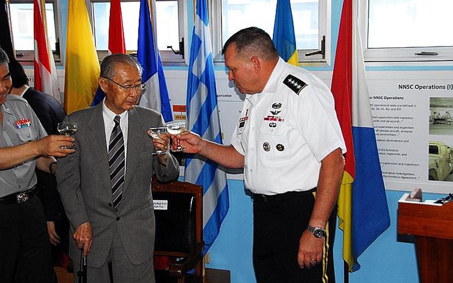 U.S. Forces Korea commander Gen. James Thurman, right, shares a toast July 27, 2012, with retired South Korean Gen. Paik Sun-yup at the Demilitarized Zone during a ceremony marking the 59th anniversary of the armistice that effectively ended the Korean War.