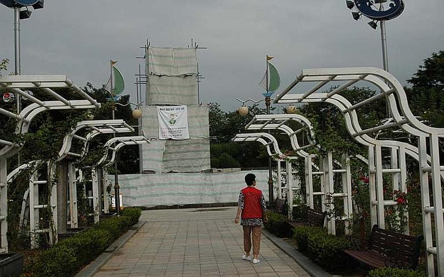 A statue of Gen. Douglas MacArthur at a park in Incheon, South Korea, is shielded from public view on Aug. 14, 2012, as renovations on the structure are completed. The statue has been a lightning rod for controversy in the years since it was erected in 1957 between groups who believe it should be removed, and others that think it should be a national landmark.