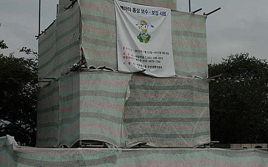 A statue of Gen. Douglas MacArthur at a park in Incheon, South Korea, is shielded from public view on Aug. 14, 2012, as renovations on the structure are completed. The statue has been a lightning rod for controversy in the years since it was erected in 1957 between groups who believe it should be removed, and others that think it should be designated a national landmark.