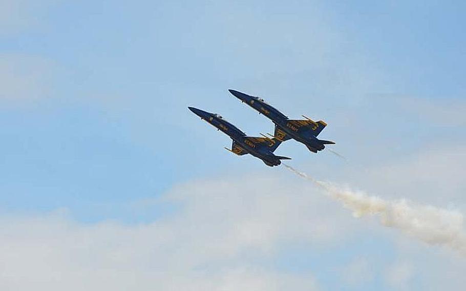 Two members of the Blue Angels fly in tandem during the Kaneohe Bay Air Show on Sept. 30, 2012, at Marine Corps Base Hawaii. Tens of thousands of spectators turned out at Kaneohe Bay to watch the Navy aerobatic team, along with other aviators and parachutists.