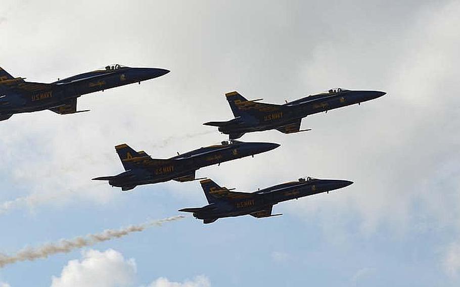 Members of the Blue Angels fly in a close pattern during the Kaneohe Bay Air Show on Sept. 30, 2012, at Marine Corps Base Hawaii. Tens of thousands of spectators turned out at Kaneohe Bay to watch the Navy aerobatic team, along with other aviators and parachutists.