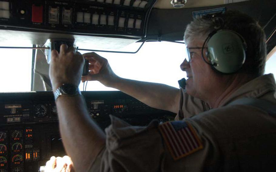 Pilot Jim Smolka takes a photo of Mount Fuji from the cockpit of the C-20A -- a military variant of the Gulfstream jet -- during a NASA mission headed toward northern Honshu on Oct. 8, 2012. The retired Air Force test pilot is part of a NASA team that deployed to Japan to study volcanoes.