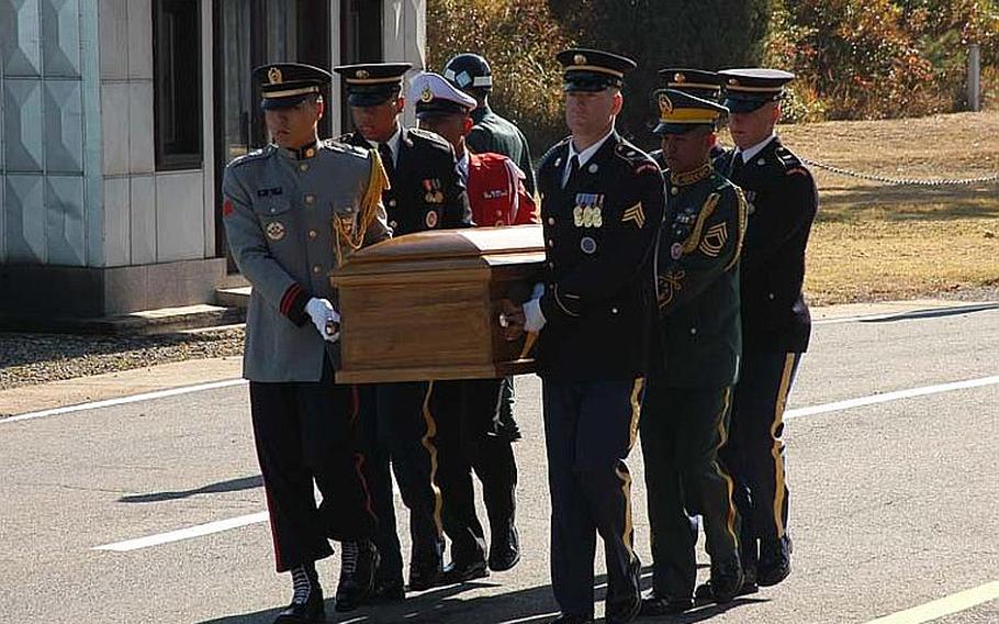 A United Nations Command Honor Guard carries a casket containing the remains of a North Korean soldier during a repatriation ceremony Oct 18, 2012, in the Joint Security Area of the Demilitarized Zone. The soldier&#39;s body was pulled Aug. 23 from the Hantan River, about two milies south of the Military Demarcation Line that divides the two Koreas.