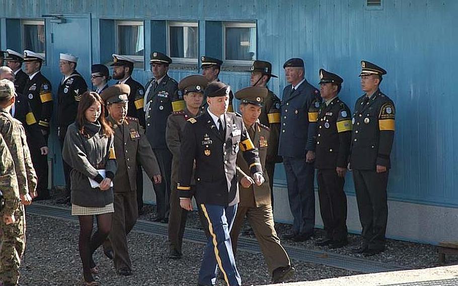 North Korean officers are led onto the south side of the Military Demarcation Line that divides the two Koreas during a repatriation ceremony Oct. 18, 2012, in the Demilitarized Zone, during which the remains of a North soldier were returned.