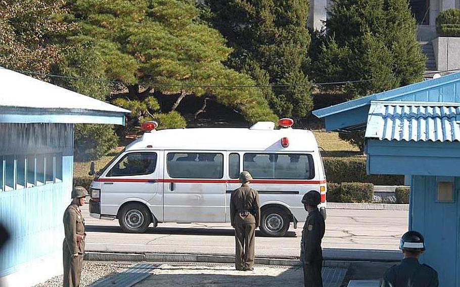 An ambulance rolls away from a repatriation ceremony on Oct. 18, 2102, in the Joint Security Area of the Demilitarized Zone after picking up the remains of a North Korean soldier found dead on the south side of the line dividing the two Koreas.