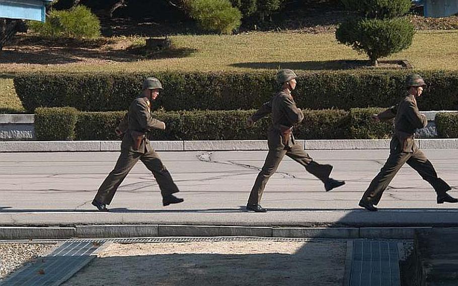 North Korean soldiers march away after a repatriation ceremony on Oct. 18, 2012, in the Joint Security Area of the Demilitarized Zone.