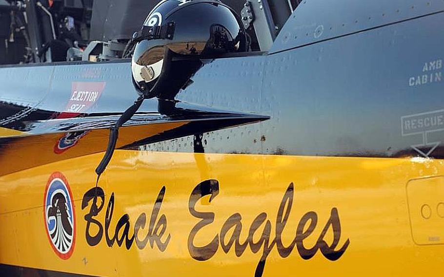 A helmet for Black Eagles team member eight sits atop the side of an open canopy of a T-50B at Osan Air Base, South Korea on Oct. 18, 2012.