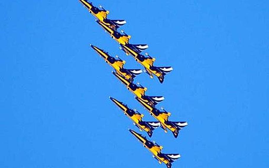 The  Republic of Korea Air Force Black Eagles aerobatic team of eight flies upward as a group during a practice run Thursday over Osan Air Base, South Korea on Oct. 18, 2012. Earlier this year, the team performed the Royal Air Force Waddington International Air Show, its first show outside of South Korea.