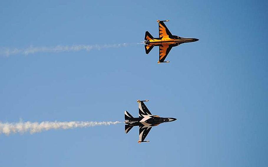 A pair of Republic of Korea Air Force Black Eagles fly alongside each other to present a top and bottom view during practice aerial demonstration at Osan Air Base, South Korea on Oct. 18, 2012.