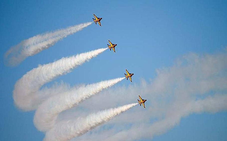 South Korean T-50B Black Eagles filled the skies over Osan Air Base on Oct. 18, 2012, during a practice aerial demonstration. The team is expected to give a demonstration this weekend at the Osan Air Power Day 2012 event.