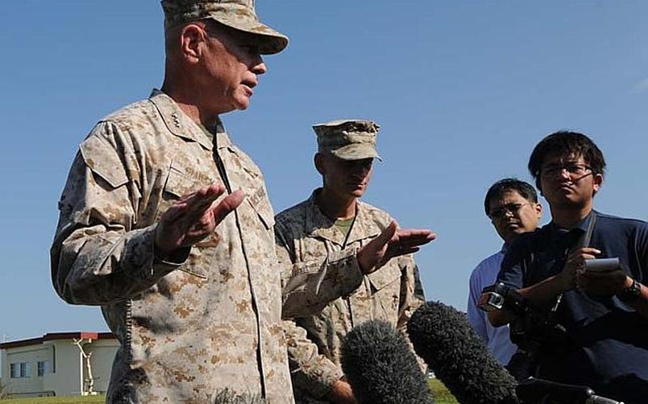 Lt. Gen. Kenneth J. Glueck, commanding general of the III Marine Expeditionary Force and Marine Corps Bases Japan, speaks on Oct. 26, 2012, to local media on Camp Foster following an all-hands address to about 1,000 Marines and sailors assigned to the Marine Corps base.