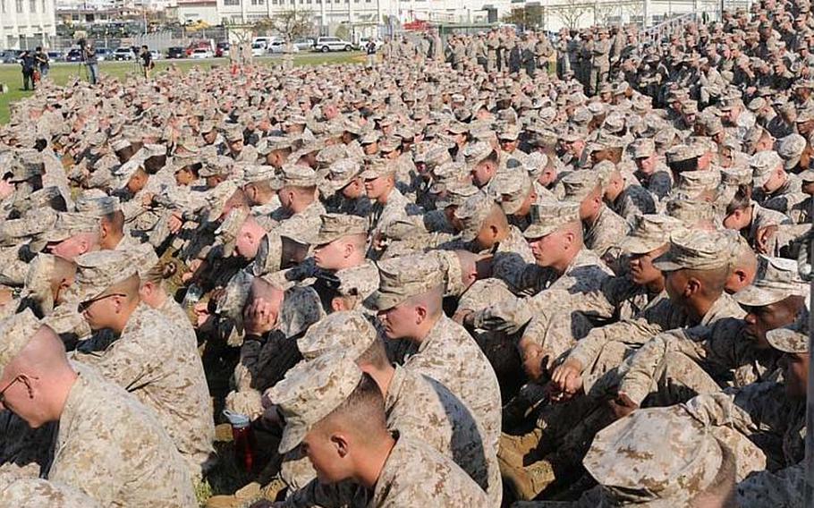 About 1,000 Marines and sailors assigned to Camp Foster gather on Oct. 25, 2012, at the base&#39;s parade field for all-hands address by Lt. Gen. Kenneth J. Glueck, commanding general of the III Marine Expeditionary Force and Marine Corps Bases Japan.