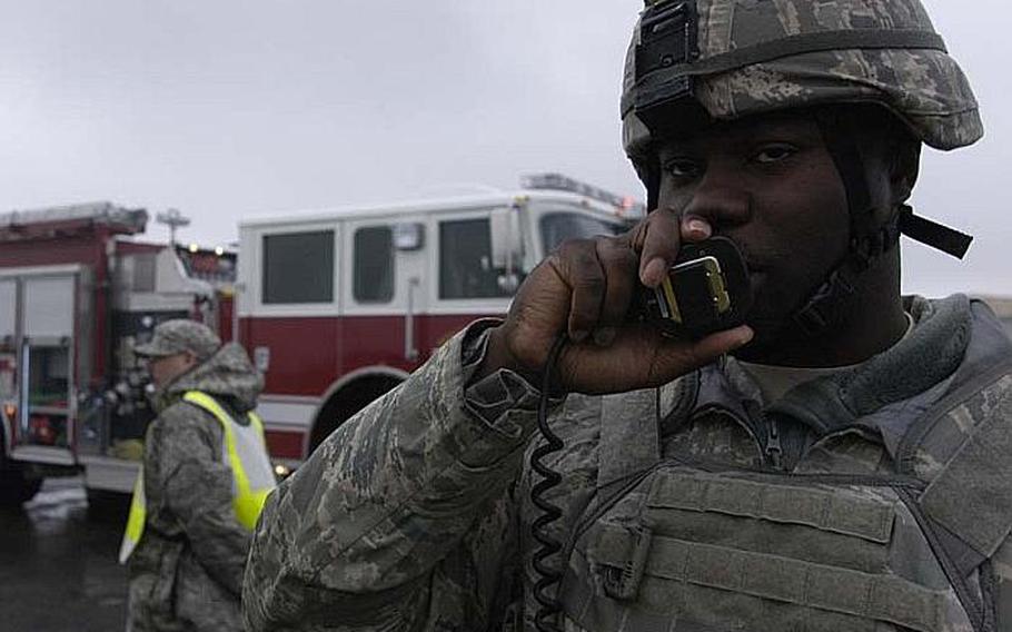 Master Sgt. Edward Johnson, from the 374th Security Forces Squadron at Yokota Air Base, Japan, talks on his radio on Nov. 6, 2012, during a disaster response training exercise. The scenario revolved around a tornado hitting the base.