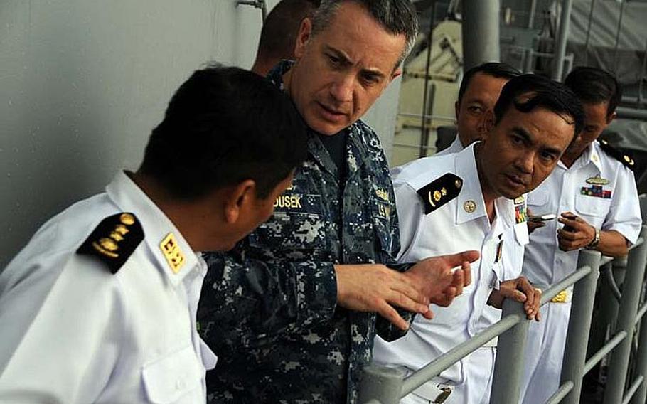 Capt. Daniel Dusek, commanding officer of the amphibious assault ship USS Bonhomme Richard, gives a ship tour to Myanmar naval officers on Nov. 18, 2012, in the Andaman Sea. Although sanctions prevent a large-scale relationship between the two militaries, the two countries are exploring academic and small-group exchanges.