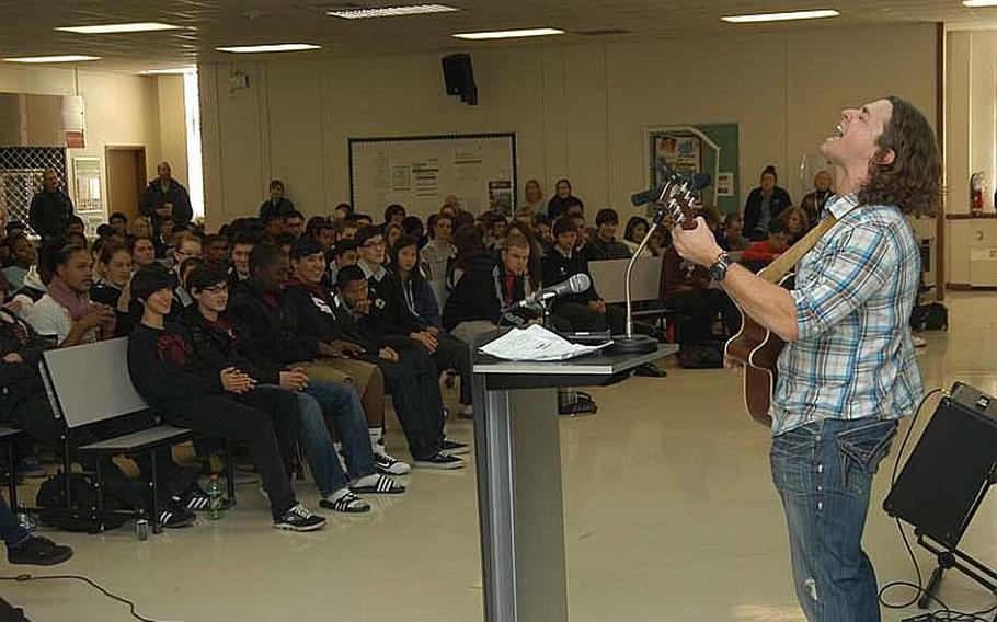 Wesley Cook, a singer from Atlanta, performs for students at Daegu High School on Camp Walker in South Korea Thursday. Cook, who was raised in Department of Defense Dependents Schools, wanted his appearance to inspire students to appreciate the education they receive as Americans overseas.