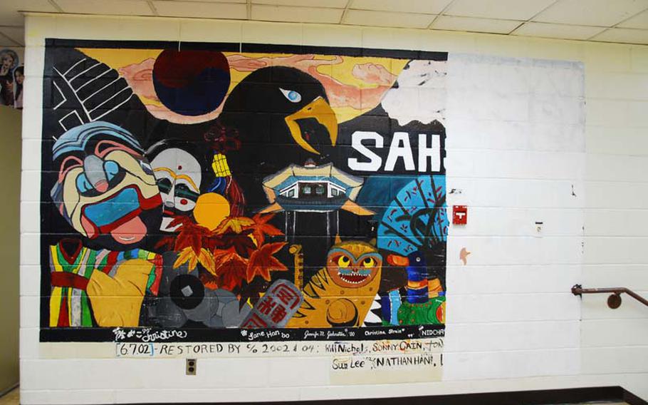 This mural at Seoul American High School could soon be replaced with a newer one. The decision to cover the old mural has prompted an outcry from students and alumni. Part of the mural already has been painted over.