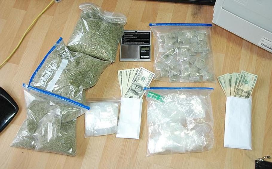 Police display about two pounds of Spice, a large amount of cash, a scale and plastic bags seized Friday during a raid on the home of a former U.S. soldier in Pyeongtaek, South Korea. The former soldier is suspected of selling the drug to more than a dozen American servicemembers, and a warrant has been issued for his arrest.

Courtesy of Pyeongtaek Police