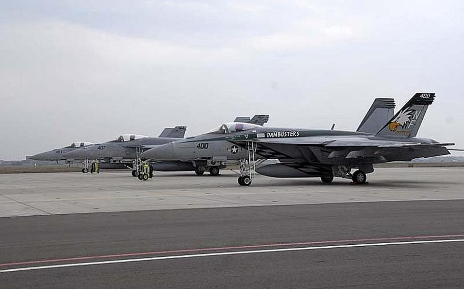 Strike Fighter Squadron 195, also known as the "Dambusters," stationed out of Naval Air Facility Atsugi, refuel their F/A-18E Super Hornet on the Naval Air Facility Misawa Ramp in this May 8, 2012, photo. The Super Hornets and the rest of Carrier Air Wing Five were scheduled to move to MCAS Iwakuni in 2014 as part of a realignment of forces in Japan, but that move has been delayed by three years, Japan officials announced on Thursday.