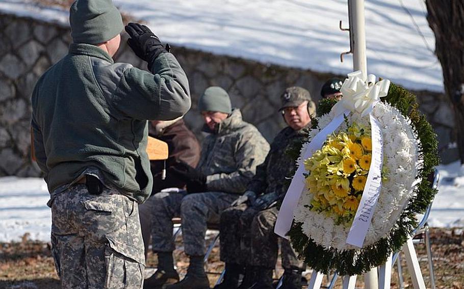 Lt. Col. Paul Vido, commander of the 3rd Battlefield Coordination Detachment-Korea, salutes after laying a wreath atop Hill 180 on Osan Air Base, South Korea on Feb. 7, 2013. Col. Lewis Millett led his famed bayonet charge on the same hill against Chinese and North Korean forces 62 years ago, earning him the Medal of Honor.
