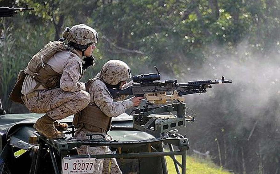 Marines conduct rifle training near Camp Schwab on Okinawa in March 2013.