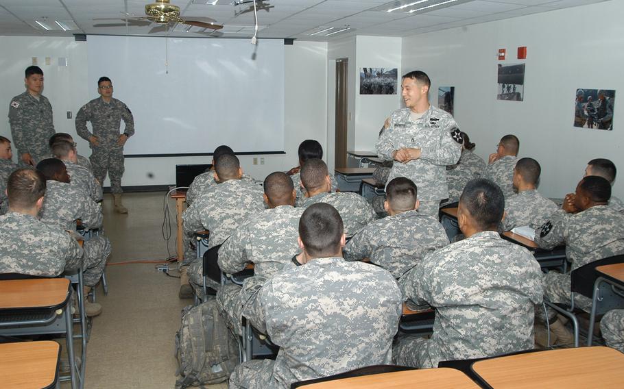 Instructor Sfc. Hun Lee Rosenberry, right, recently greets a group of newly arrived 2nd Infantry Division soldiers to Camp Hovey in South Korea, at the start of a cultural awareness training class April 19, 2013. The 2ID recently expanded its cultural awareness training program in hopes of curbing the number of future confrontations between soldiers and Koreans. 