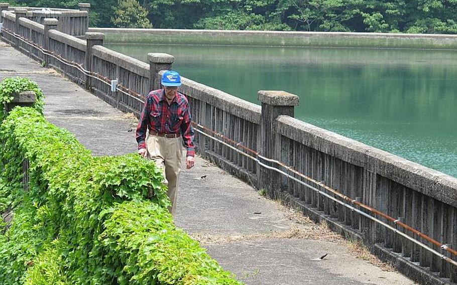 Leroy Myers leaves Sasebo's Soto Dam after the 93-year-old came back to see it one final time May 25, 2013, 72 years after his captivity and forced labor during World War II.