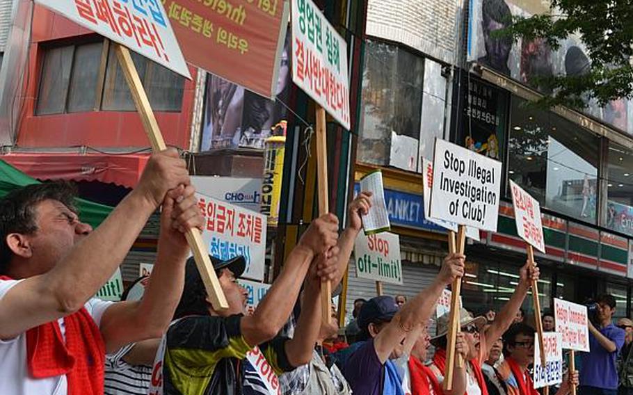 South Korean protesters demonstrating against the 51st Fighter Wing command's decision to make some bars off-limits outside Osan Air Base, South Korea, June 14, 2013.