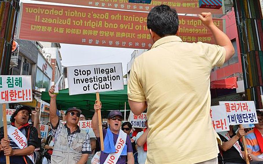 South Korean protesters rally against the 51st Fighter Wing command at the Songtan Entertainment District outside Osan Air Base, South Korea, June 14, 2013. They were protesting the command's decision to make some bars off-limits.