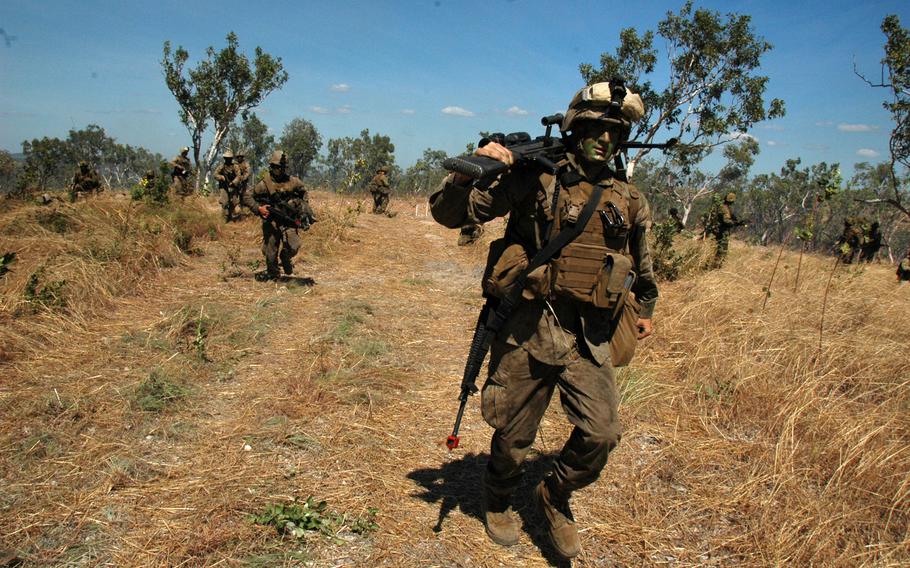 U.S. Marines move forward in support of Australian soldiers during an exercise at Mount Bundey Training Area, Northern Territory on Thursday. 

