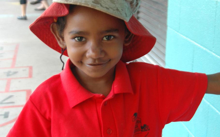 Nancy Issac, 5, a Torres Strait Islander, sports a Marine's cover at Moulden Park Primary School.
