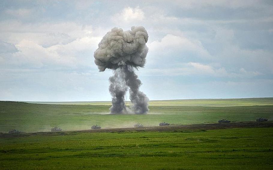 Russian Army Engenering tanks drive near the Baikal Lake in Russia on Wednesday, July 17, 2013. Russia has launched its biggest military maneuvers since Soviet times, involving 160,000 troops and about 5,000 tanks across Siberia and the far eastern region. 