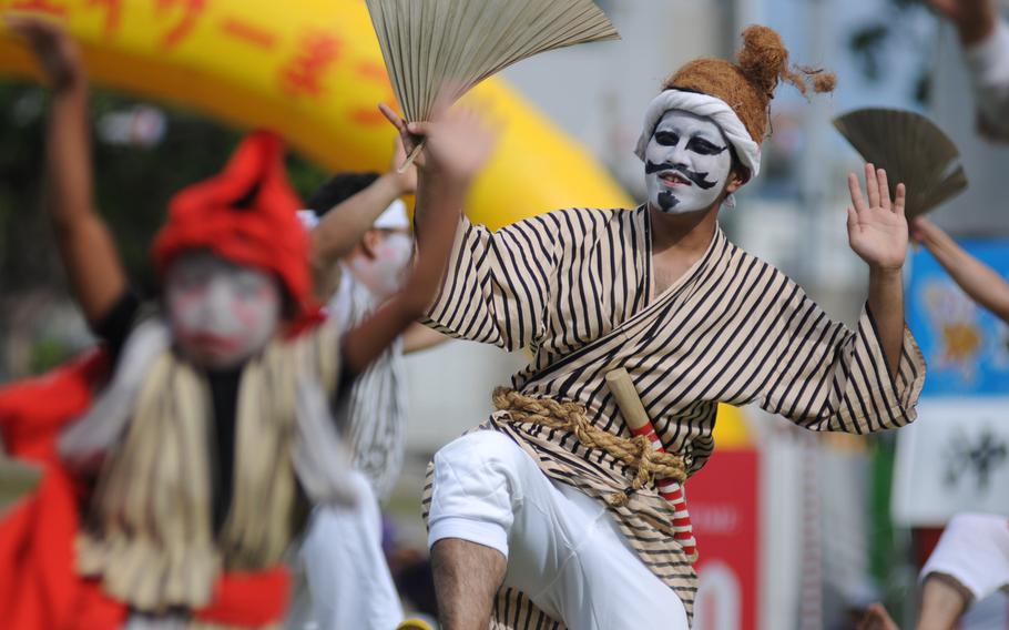 Dancers and musicians put on a colorful spectacle at the 58th Okinawa Zento Eisa Matsuri contest in Okinawa City, Okinawa, Sept. 1, 2103.