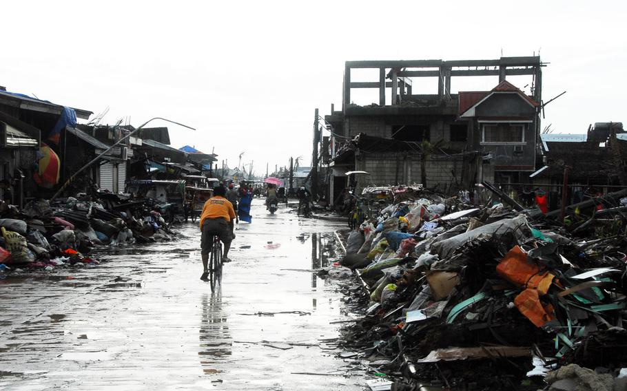 Trash piles up on the streets of typhoon devastated Guiuan on Friday.