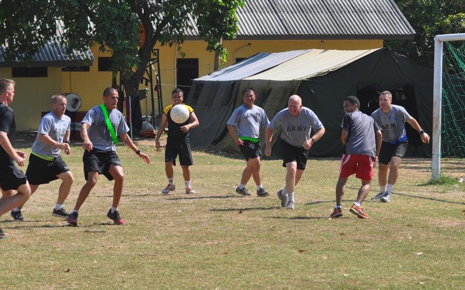 Soldiers play a game of early morning soccer at Puslatpur Marine Base during Garuda Shield exercise. Most mornings Indonesian and American soldiers joined in PT and soccer games.