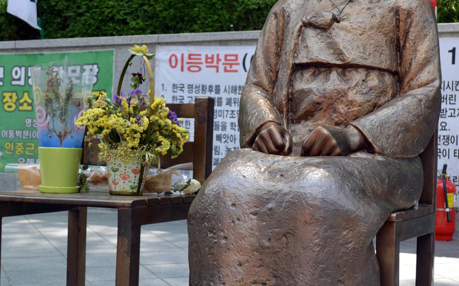 The Pyeonghwa-bi, Peace Monument, sits across the street from the Japanese Embassy in Seoul, South Korea. The monument is a representation of Koreans who were forced into sexual slavery by the Japanese military during World War II.
