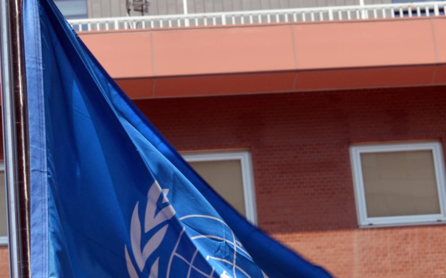 The United Nations flag flutters in the air across the street from the Japanese Embassy in Seoul, South Korea, on May 21, 2014. The South Korean representative to the U.N. has called for the Japan to compensate victims forced into prostitution during World War II.