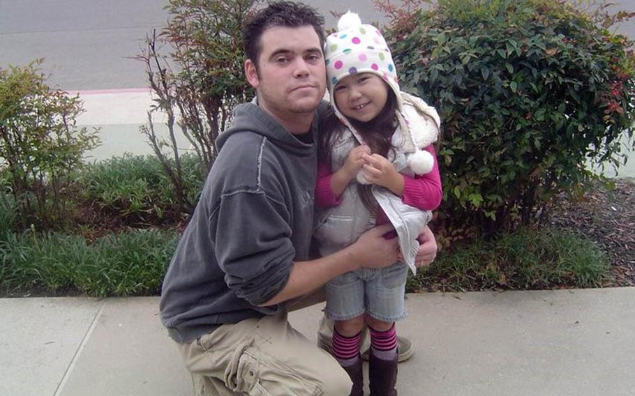 Donny and Christina Conway pose near their former near Naval Air Station Lemoore, Calif., in this undated photo. Conway hasn’t seen or heard from his daughter, who is believed to be in Japan, since 2012.