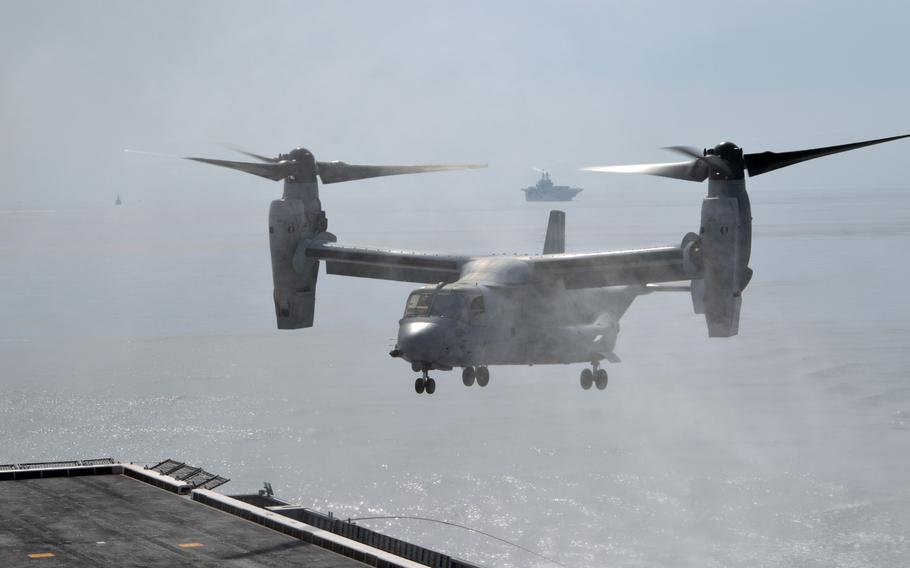 A U.S. Marine Corps MV-22 Osprey sends up an ocean spray as it nears the deck of the ROKS Dokdo on March 26, 2015. The MV-22 belongs to the Marine Medium Tiltrotor Squadron 262 Reinforced. 

