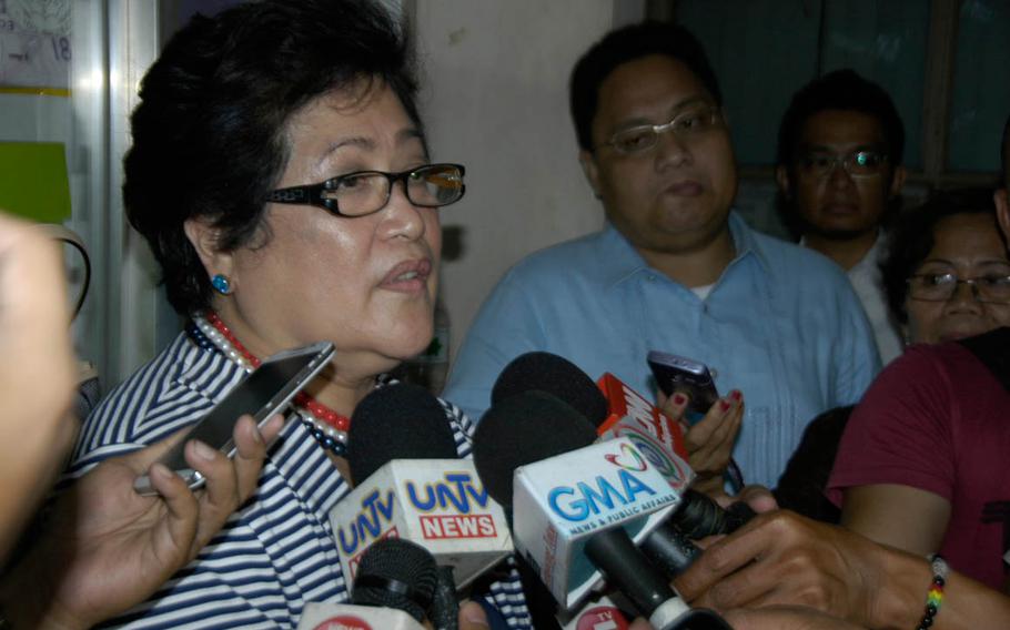 Prosecutor Emilie Fe de los Santos talks to reporters in March 2015 after the 1st day of the trial of U.S. Marine Pfc. Joseph Scott Pemberton, who is accused of murdering Filipina transgender woman Jeffrey 'Jennifer' Laude.