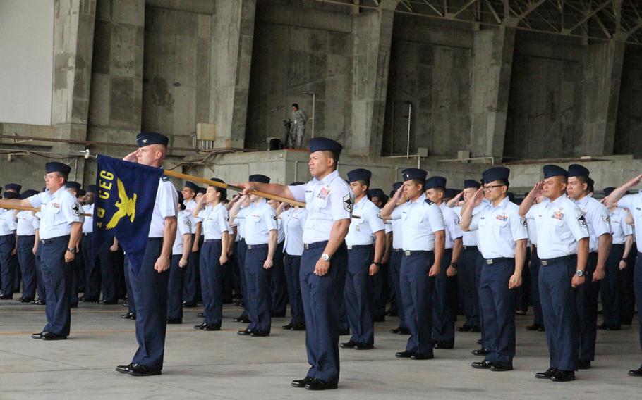 Airmen offer outgoing 18th Wing commander Brig. Gen. James Hecker a final salute Thursday during a change-of-command ceremony at Kadena Air Base, Okinawa.