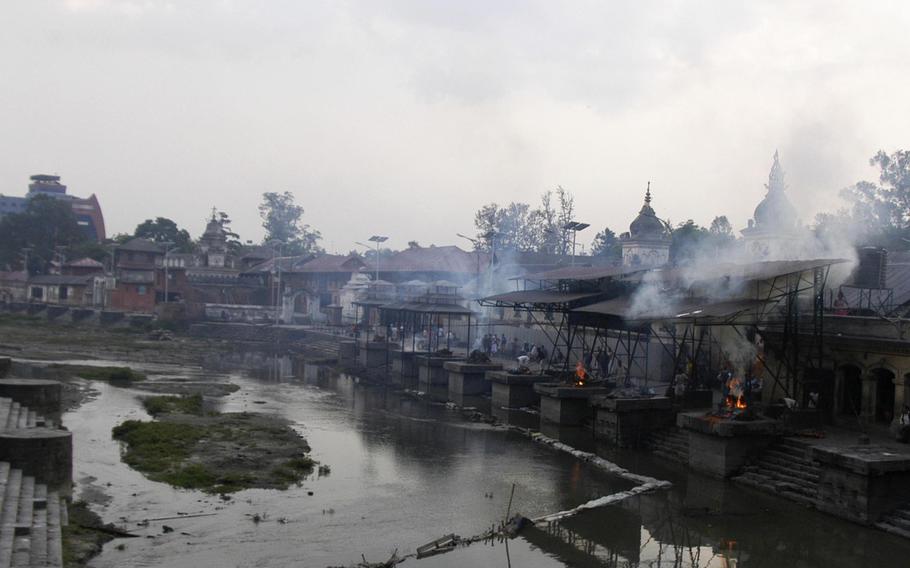 Following Hindu tradition, bodies are cremated beside the Bagmati River, Nepal, on May 6, 2015. More than 7,500 people died after a 7.9 magnitude earthquake hit the region on April 25.