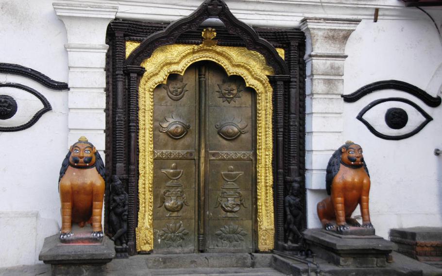 Lions guard the exit to the Pashupatinath temple in Kathmandu, Nepal. The temple, devoted to the Hindu god of living things, can be entered only by those who follow the religion.