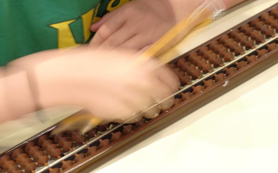 Students from Yokosuka Naval Base, Atsugi Naval Air Station, Camp Zama and Yokota Air Base participate in the DODEA Pacific Japan District's 33rd annual Soroban Contest at the New Sanno Hotel in Tokyo on May 13, 2015. The soroban is a Japanese abacus that dates to 600 B.C. and is still relied on for quick and accurate calculations to complex math problems.