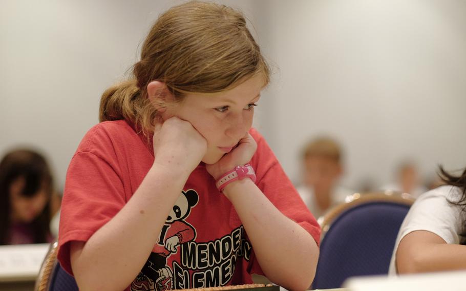 Ashley Ross of Joan K. Mendel Elementary School in Yokota Air Base, Japan, waits for a judge to collect her answer sheet during the DODEA Pacific Japan District's 33rd annual Soroban Contest at the New Sanno Hotel in Tokyo on May 13, 2015. A total of 110 middle school and elementary school students from several U.S. bases demonstrated their skills with an abacus during the competition.