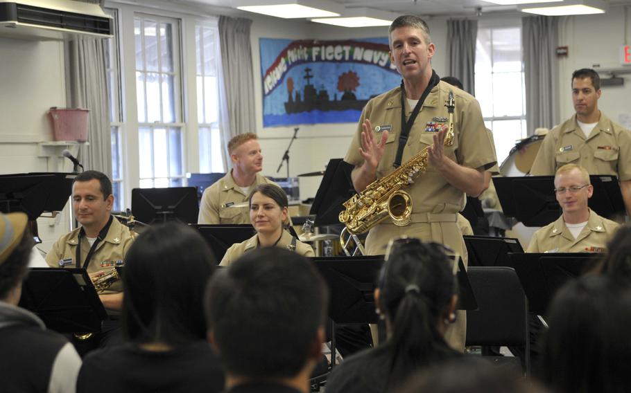 Chief Petty Officer Ian Cherleton, the Pacific Fleet Band Jazz Ensemble unit leader, speaks to students from the Honoka'a High School Jazz Band during a music clinic in April at the Pacific Fleet Band Hall on Joint Base Pearl Harbor-Hickam. The students visited as part of the Pacific Fleet Band's Music Education Outreach program, which aims to create a bridge between the military and civilians through musical entertainment and educational clinics.