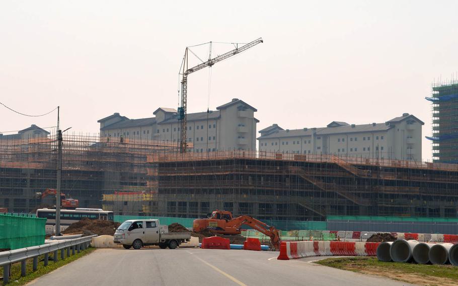 New barracks under construction at Camp Humphreys, South Korea, on April 24, 2015. In the background are recently completed barracks.