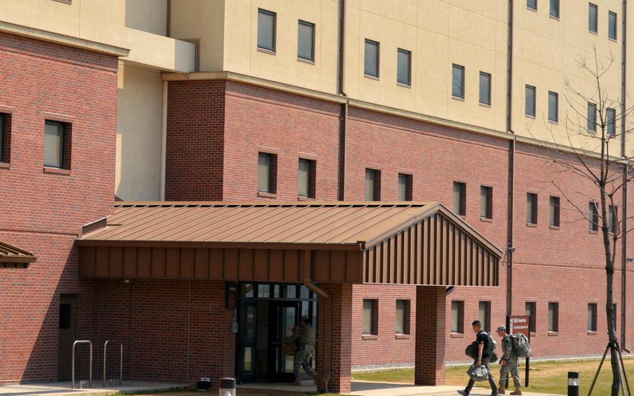 U.S. Army soldiers entering one of the new barracks constructed at Camp Humphreys, South Korea, on April 24, 2015.